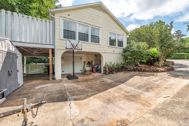 702 W Lee St, Enterprise, AL 36330 - view of front facade with a garage and driveway
