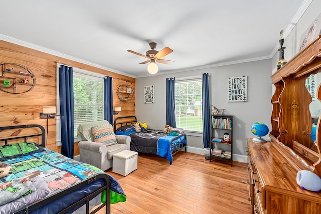 702 W Lee St, Enterprise, AL 36330 - bedroom with multiple windows, ornamental molding, light wood-style floors, and a ceiling fan