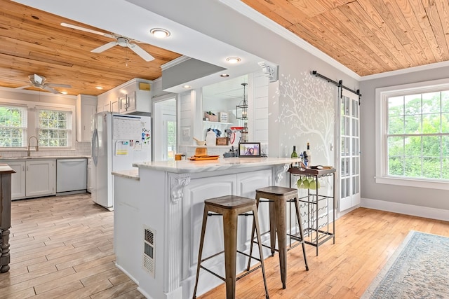 702 W Lee St, Enterprise, AL 36330 - kitchen featuring wood ceiling, white appliances, crown molding, a ceiling fan, and a kitchen bar