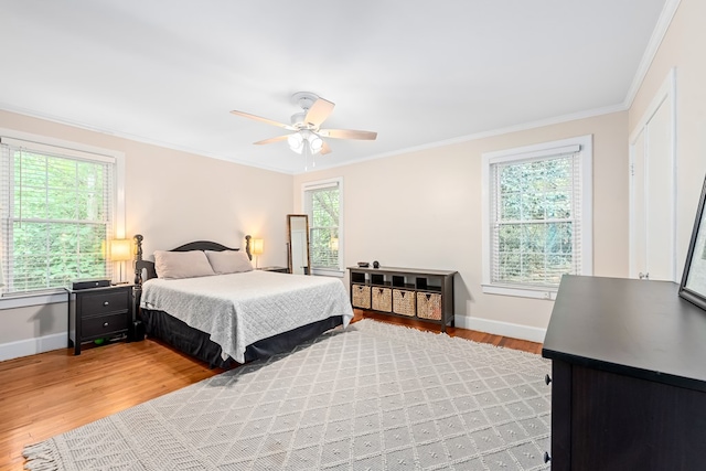 702 W Lee St, Enterprise, AL 36330 - bedroom with ornamental molding, light wood-style floors, and a ceiling fan
