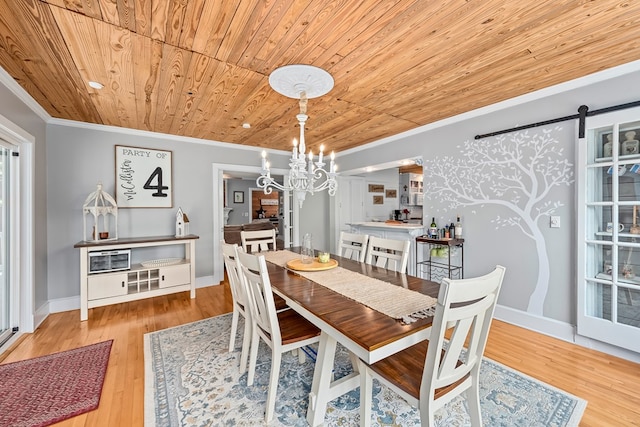 702 W Lee St, Enterprise, AL 36330 - dining room with wood ceiling, crown molding, a chandelier, wood finished floors, and a barn door