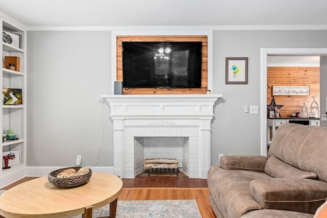 702 W Lee St, Enterprise, AL 36330 - living room with wood finished floors, crown molding, and a fireplace