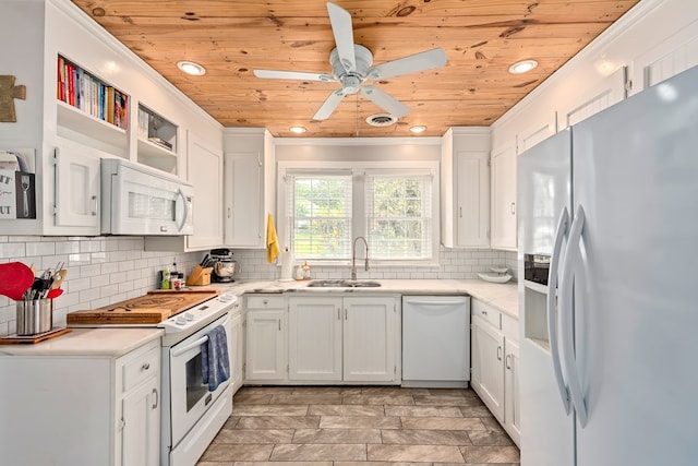 702 W Lee St, Enterprise, AL 36330 - kitchen with white appliances, wooden ceiling, white cabinetry, a ceiling fan, and decorative backsplash