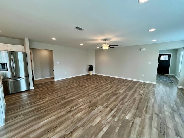 unfurnished living room featuring ceiling fan and light wood-type flooring