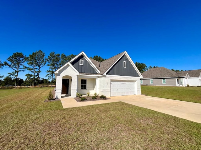 view of front facade with a garage and a front lawn