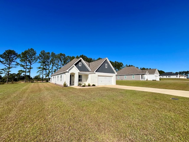 view of front of home featuring a garage and a front lawn