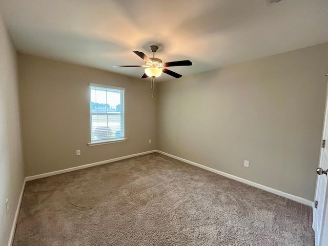 carpeted empty room with ceiling fan