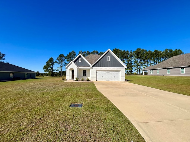 view of front of home with a garage and a front lawn