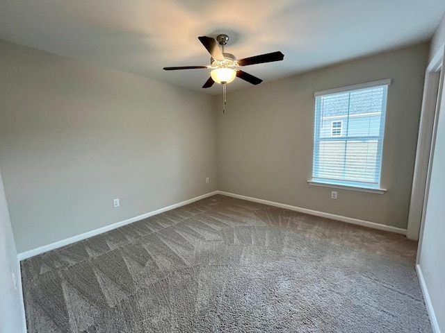 spare room with carpet flooring and ceiling fan