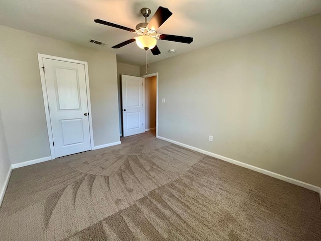 unfurnished bedroom with carpet floors and ceiling fan