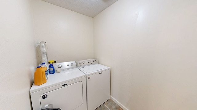 1622 W Main St, Daleville, AL 36322 - washroom featuring separate washer and dryer, light tile patterned flooring, and a textured ceiling