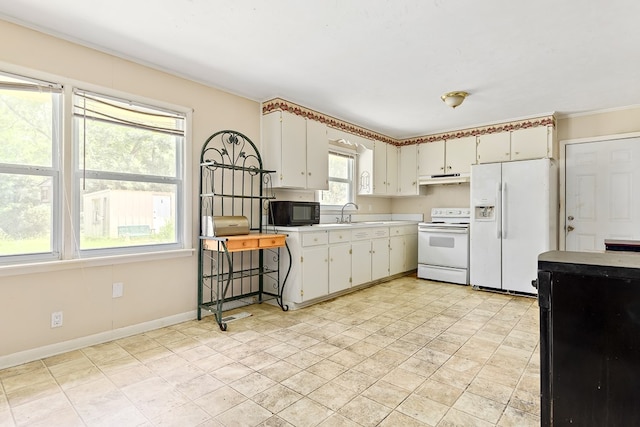 803 Dogwood Trl, Dothan, AL 36301 - kitchen featuring white appliances, light countertops, under cabinet range hood, and white cabinets