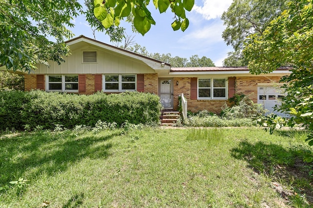 803 Dogwood Trl, Dothan, AL 36301 - single story home featuring brick siding, a garage, a front lawn, and board and batten siding