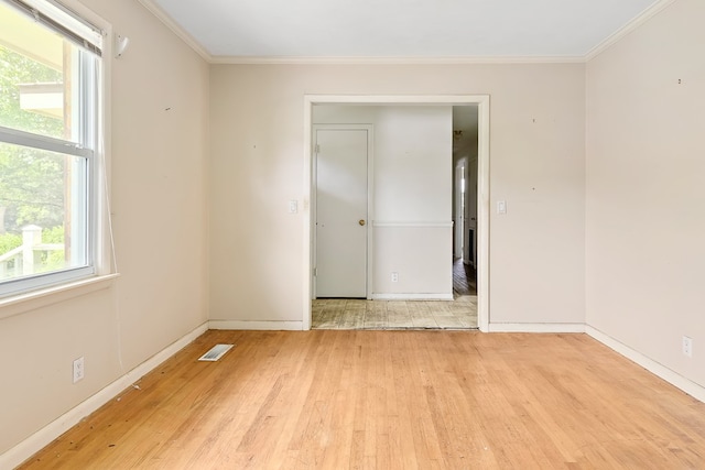 803 Dogwood Trl, Dothan, AL 36301 - spare room featuring light wood-style flooring and crown molding