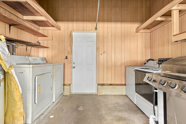 803 Dogwood Trl, Dothan, AL 36301 - laundry area featuring washer and dryer and wood walls