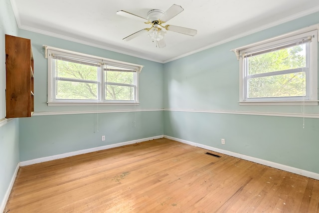 803 Dogwood Trl, Dothan, AL 36301 - empty room with wood finished floors, crown molding, and a ceiling fan