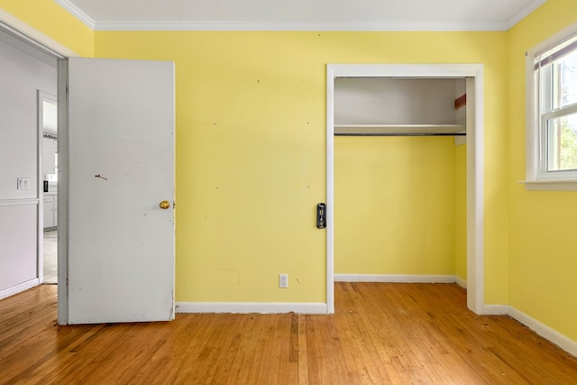 803 Dogwood Trl, Dothan, AL 36301 - unfurnished bedroom with wood-type flooring, ornamental molding, and a closet