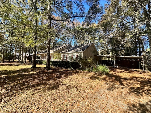 view of yard featuring a carport