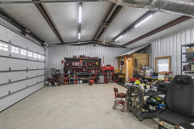 garage with ceiling fan and a workshop area