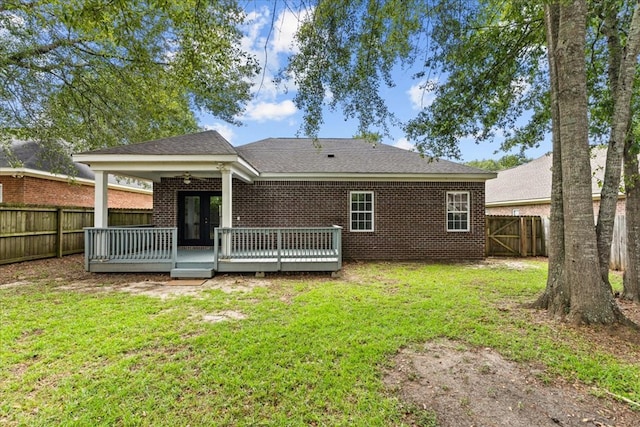 133 Brockton Ct, Dothan, AL 36305 - back of property with a fenced backyard, french doors, a deck, and brick siding