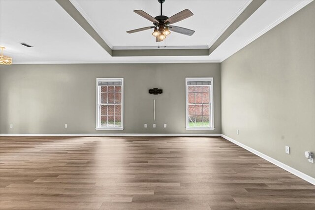 133 Brockton Ct, Dothan, AL 36305 - unfurnished room featuring a raised ceiling, a ceiling fan, crown molding, and wood finished floors