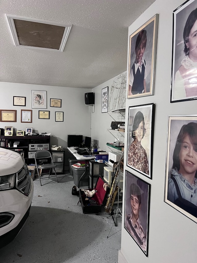 204 Melrose Ln, Dothan, AL 36303 - office area with a textured ceiling, concrete floors, and attic access