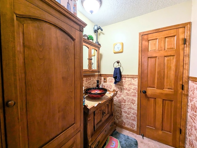 bathroom featuring vanity and a textured ceiling