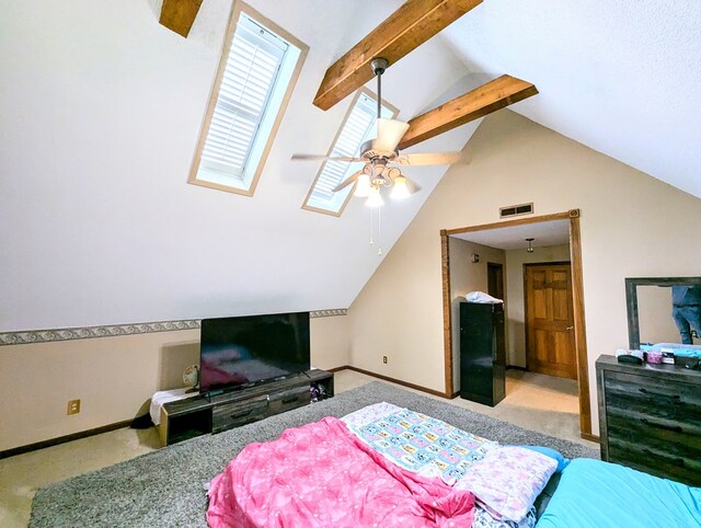 carpeted bedroom with lofted ceiling with beams and ceiling fan