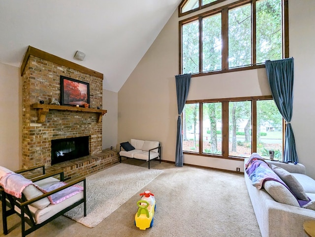 carpeted living room featuring high vaulted ceiling and a brick fireplace