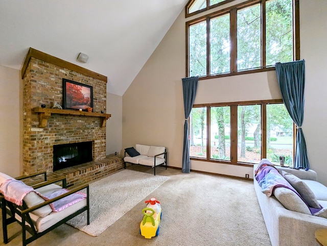 3602 Pebble Creek Ln, Dothan, AL 36303 - living area featuring high vaulted ceiling, carpet flooring, a brick fireplace, and baseboards