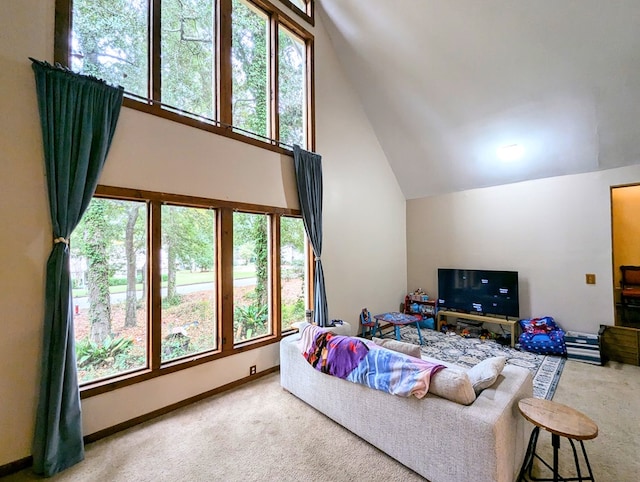 living room featuring carpet flooring and vaulted ceiling