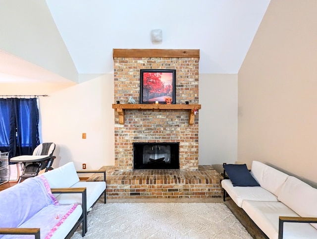 living room with a brick fireplace, light colored carpet, and vaulted ceiling