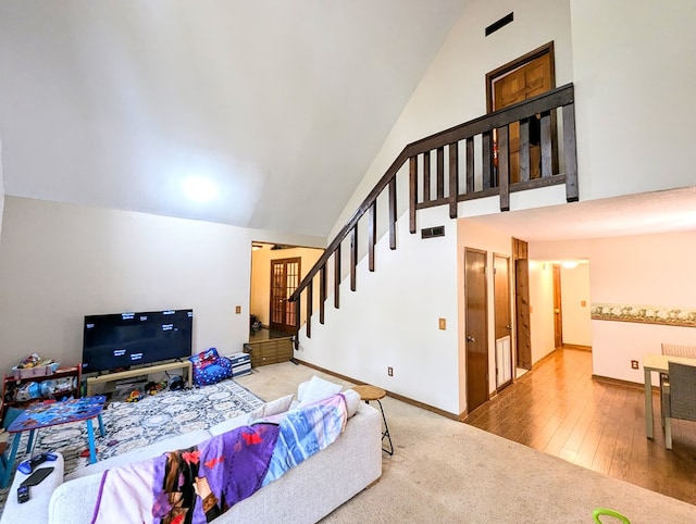 interior space with vaulted ceiling and hardwood / wood-style flooring