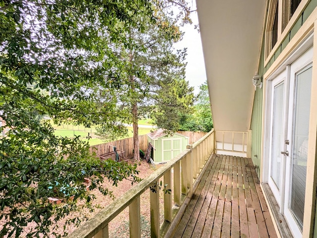 3602 Pebble Creek Ln, Dothan, AL 36303 - wooden deck featuring a storage unit, an outbuilding, and a fenced backyard