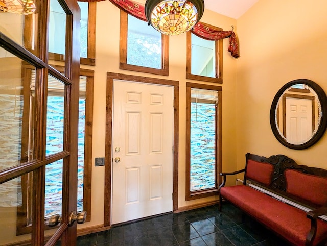 3602 Pebble Creek Ln, Dothan, AL 36303 - foyer featuring a towering ceiling, dark tile patterned flooring, and baseboards