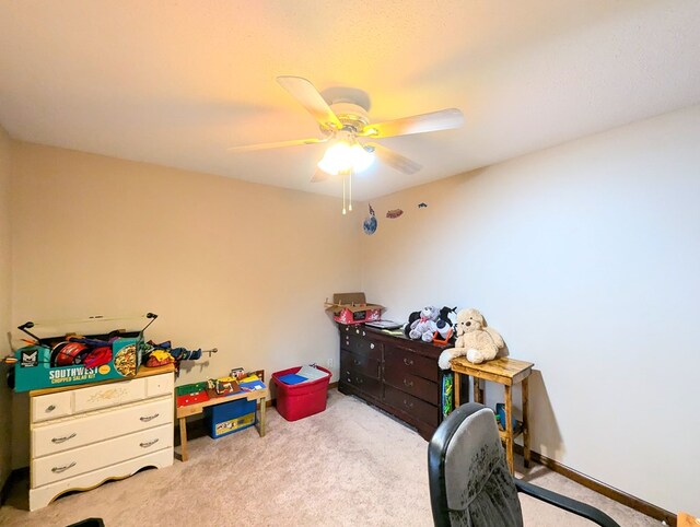 bedroom featuring ceiling fan and light colored carpet