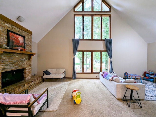 carpeted living room with a fireplace, plenty of natural light, and high vaulted ceiling