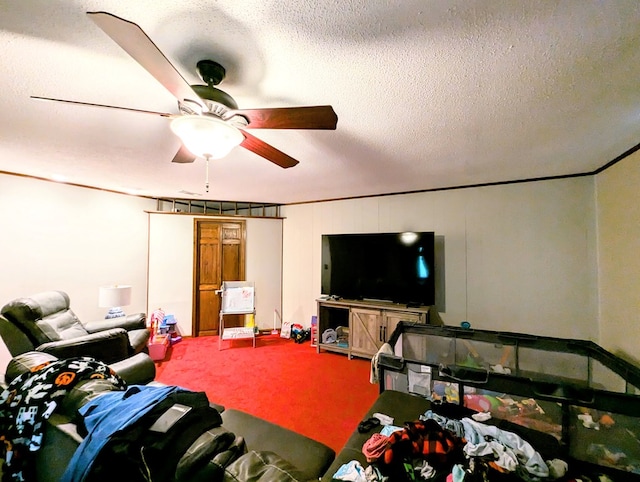 carpeted living room featuring ceiling fan and a textured ceiling