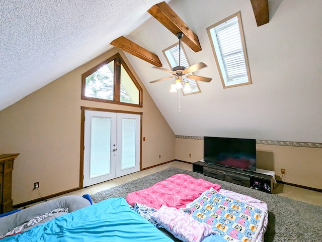 bedroom with multiple windows, ceiling fan, lofted ceiling with beams, and a textured ceiling