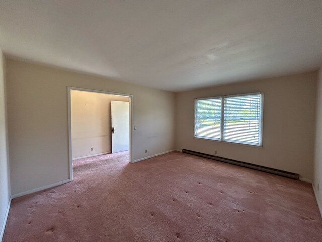 1000 Martin St, Dothan, AL 36301 - carpeted empty room featuring a baseboard radiator and baseboards