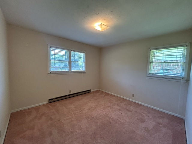 1000 Martin St, Dothan, AL 36301 - unfurnished room featuring baseboards, a baseboard radiator, and light colored carpet