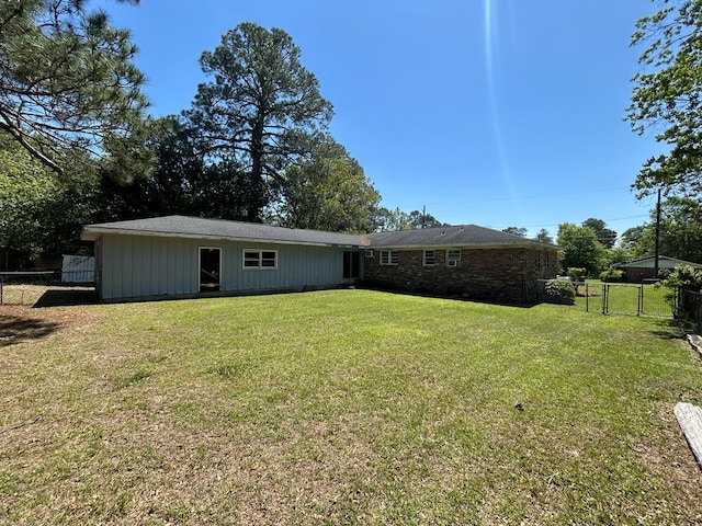 1000 Martin St, Dothan, AL 36301 - back of house with a yard, fence, and a gate