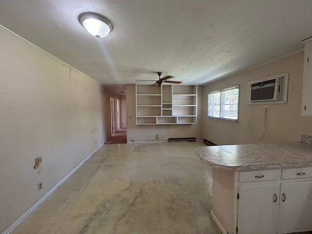 1000 Martin St, Dothan, AL 36301 - unfurnished living room with a textured ceiling, a wall mounted AC, ceiling fan, and baseboards