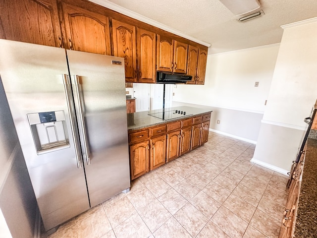 kitchen with stainless steel fridge with ice dispenser, black electric cooktop, dark countertops, crown molding, and brown cabinetry