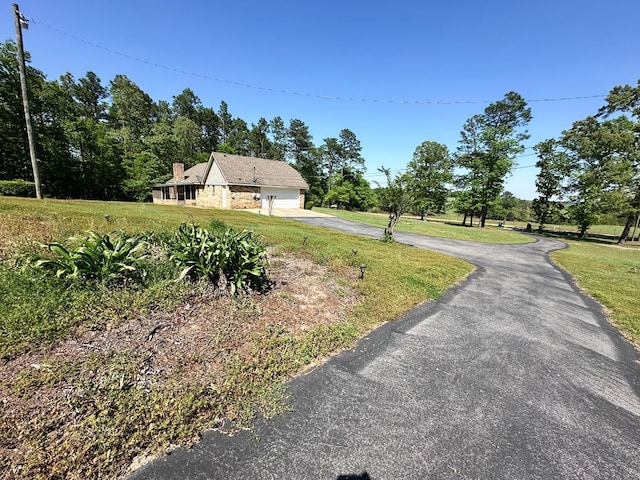 view of road featuring aphalt driveway
