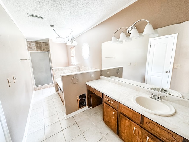 bathroom featuring vanity, a stall shower, tile patterned floors, a textured ceiling, and visible vents