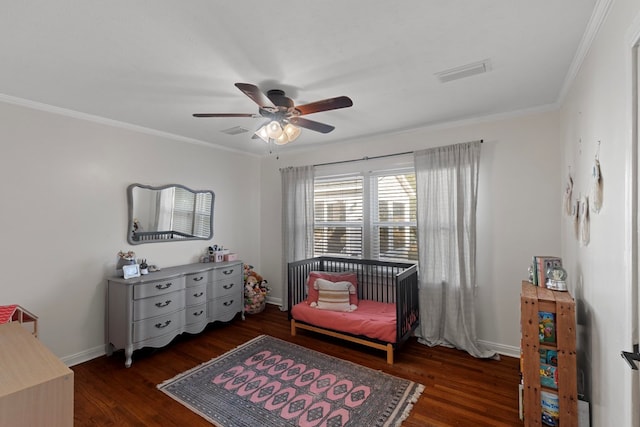 sitting room featuring ceiling fan, dark wood-type flooring, and ornamental molding