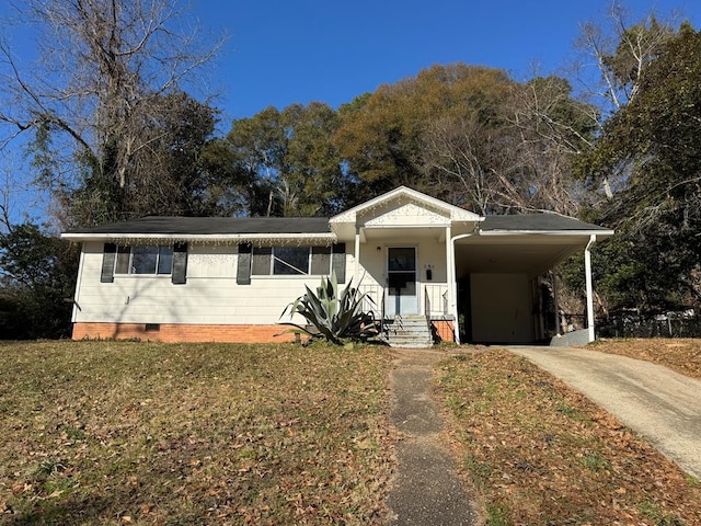 ranch-style home featuring a carport and a front yard