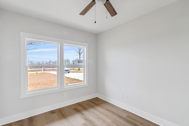 unfurnished room featuring ceiling fan and light wood-type flooring