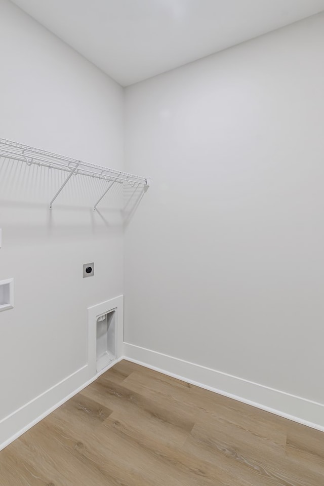 laundry room with hardwood / wood-style floors, hookup for a washing machine, and hookup for an electric dryer